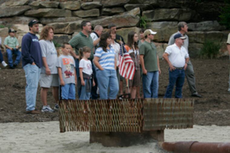 Miners gather with their families at the shaft - now part of a memorial park in Somerset, Pa. - where they were rescued.