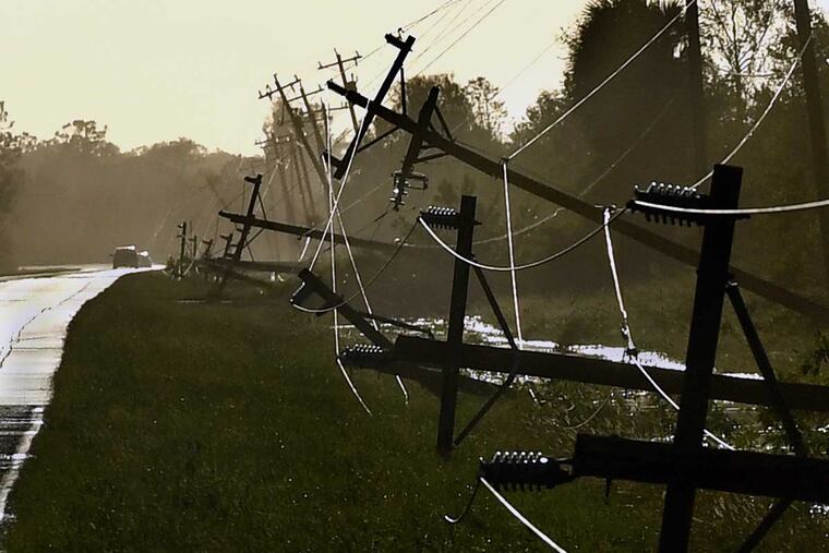 Power lines fell as a result of Hurricane Irma's winds along Corkscrew Road near Estero, Fla.