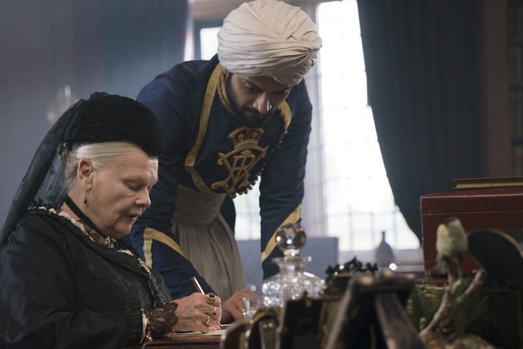 In this image released by Focus Features, Judi Dench, left, and Ali Fazal appear in a scene from "Victoria and Abdul." (Peter Mountain/Focus Features via AP)