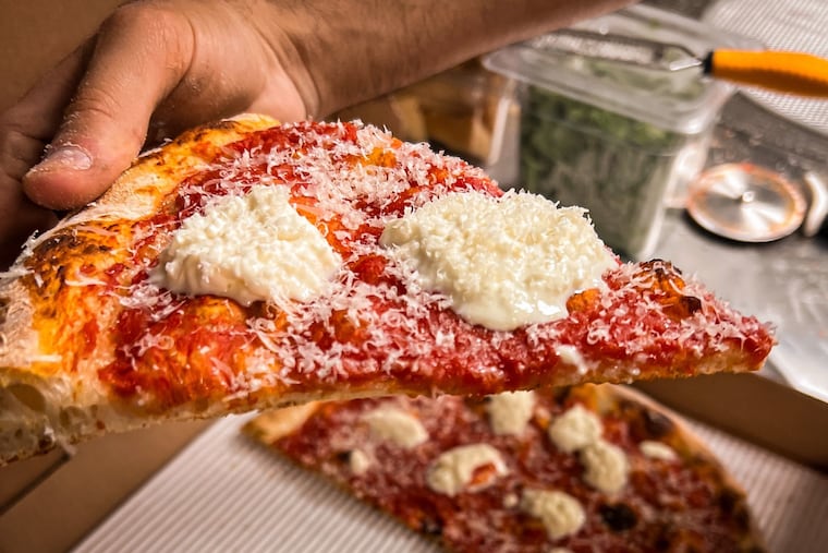 A slice of broken burrata pizza at Liguria Pizzeria, 1826 Frankford Ave.