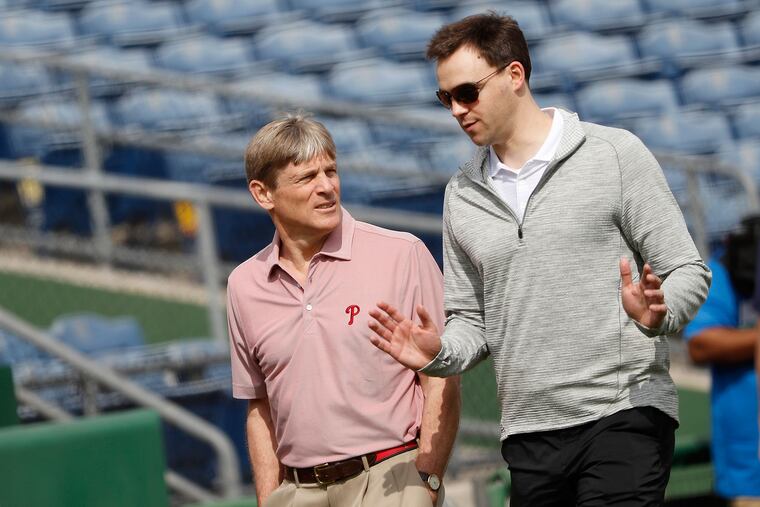 Phillies GM Matt Klentak, right, can offer advice to managing partner John Middleton, but the owner must decide if he wants to spend more than $300 million on either Bryce Harper or Manny Machado.