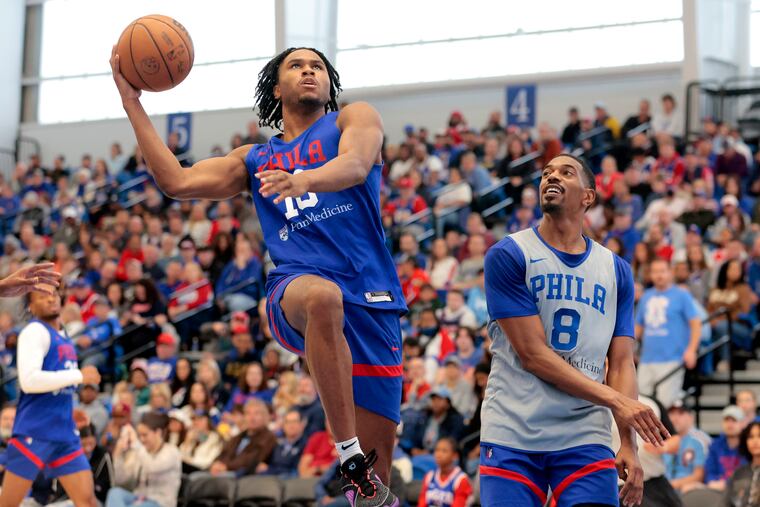 The Sixers held their annual Blue/White Scrimmage at Chase Fieldhouse in Wilmington, Delaware on Oct. 14, 2023. Ricky Council IV (left) scores gainst De'Anthony Melton.