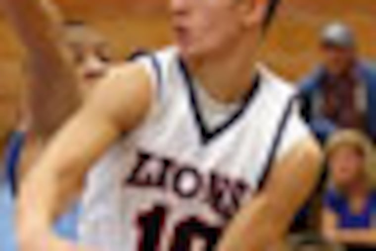 Cardinal O'Hara High's Mike Louden looks to pass the basketball against Father Judge High's Joe Robinson during the third quarter on Sunday, February 12, 2012. (Yong Kim / Staff Photographer)