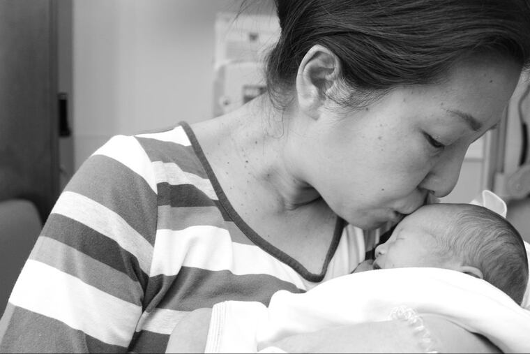 Hyoejin Yoon with her four-day-old son, Han.