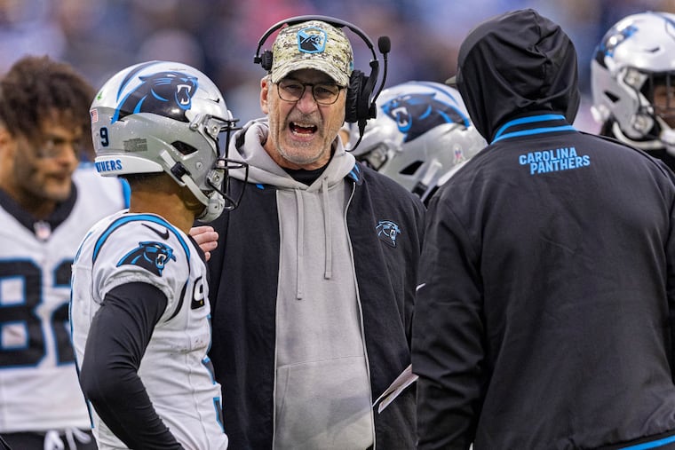 Carolina Panthers quarterback Bryce Young listens as head coach Frank Reich gives him instructions Sunday against the Tennessee Titans.