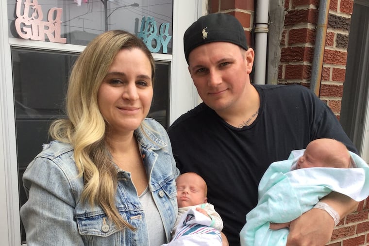 Jessica (holding Barrett) and George (holding Margot): their first family picture.
