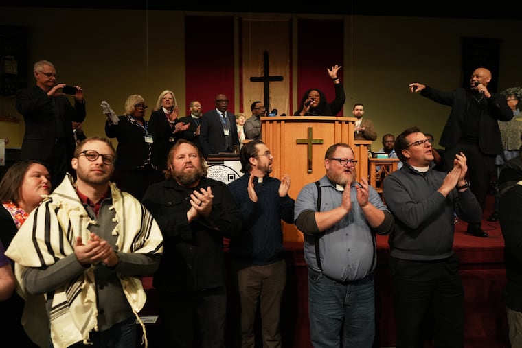Faith leaders from across the United States sing together as a sign of support for Haitian migrants fearing the end of their Temporary Protected Status in the U.S., at an event held at St. John Missionary Baptist Church in Springfield, Ohio, on Monday, Feb. 2, 2026.