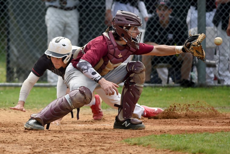 Haddonfield's Aiden Barr scores ahead of the throw to Haddon Heights catcher Vincenzo Macolino in the fourth inning.