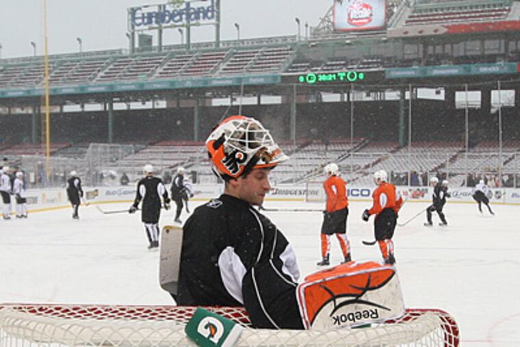 Flyers goalie Michael Leighton takes a quick water break during practice at Fenway Park yesterday. (Michael Bryant / Staff photographer)