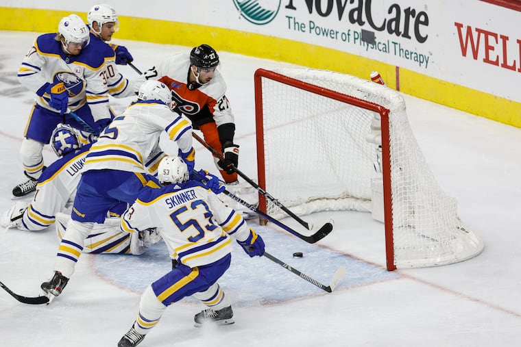 Flyers left wing Noah Cates can not get his stick on the puck behind Buffalo Sabres goaltender Ukko-Pekka Luukkonen during the second period at the Wells Fargo Center on Nov. 1.