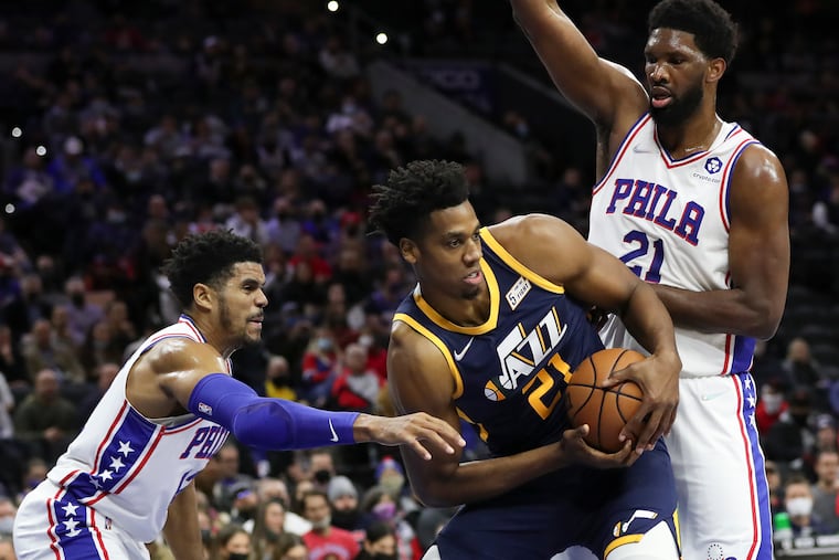 Sixers forward Tobias Harris and center Joel Embiid double team Utah Jazz center Hassan Whiteside during the first quarter.