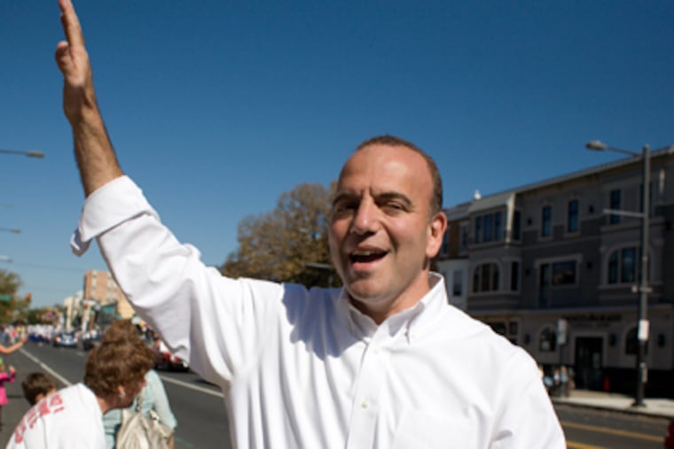 Dan Onorato, Democratic nominee for governor, waving to potential voters on Broad Street for the Columbus Day Parade. (Ed Hille / Staff Photographer)