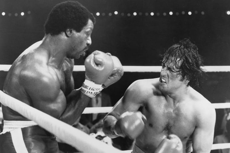 Actors Carl Weathers and Sylvester Stallone on set of the United Artist movie "Rocky II" in 1979.