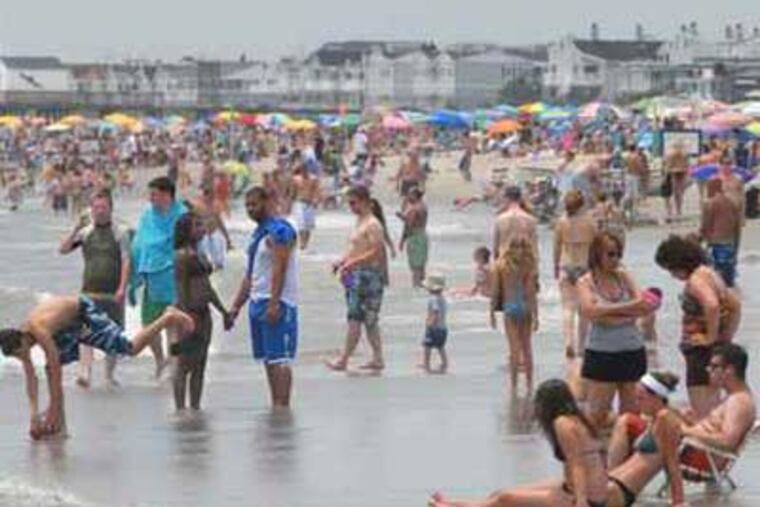 A recent Ocean City beach crowd. More folks from the Gulf region are choosing to vacation at the New Jersey Shore because of the oil leak. ( April Saul / Staff Photographer)