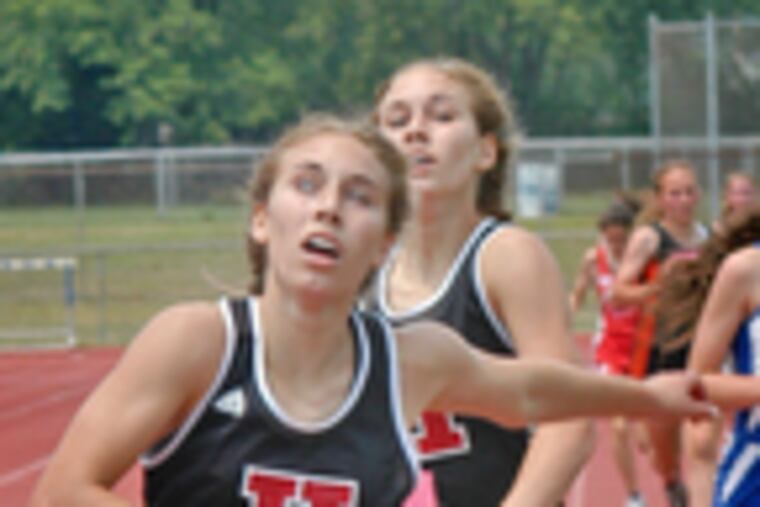 Haddonfield's Jackie Sikkema (left) edges her twin sister, Lizzy, to win the Group 2 3,200-meter race. Haddonfield won the Group 2 sectional team title with 108 points, while Kingsway took the Group 3 title with 85 points.