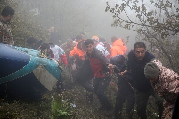Rescue team members work at the scene of a crash of a helicopter carrying Iranian President Ebrahim Raisi in northwestern Iran on Monday, May 20, 2024. Raisi, the country’s foreign miniter and several other officials were found dead.