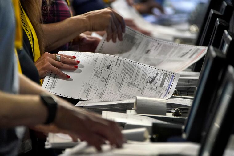 Election workers performing a recount of ballots from the recent Pennsylvania primary election at the Allegheny County Election Division warehouse on the northside of Pittsburgh.