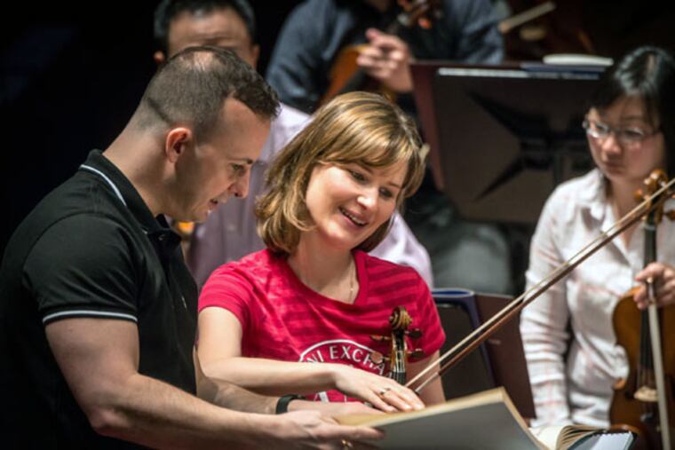 Music director Yannick Nézet-Séguin and soloist violinist Lisa Batiashvili at a rehearsal for Thursday’s Luxembourg opener. (JAN REGAN)