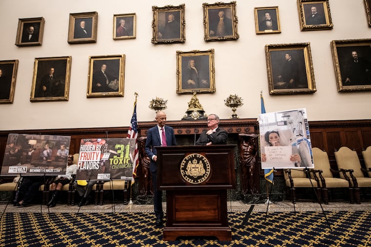 Jim Kenney, Mayor of Philadelphia and Philadelphia Health Commissioner Thomas Farley, left, speak during a press conference that announced the legislation to introduce ban sales of e-cig devices and high-nicotine and flavored pods in shops that serve customers under 18. They spoke to city official and the media at Philadelphia City Hall on Wednesday, October 16, 2019.