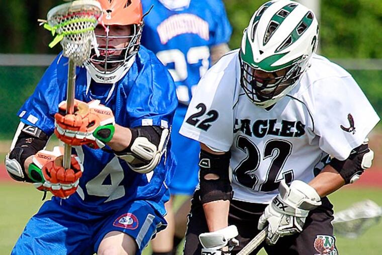 Woodstown High School's (14) Jordan Clark, left, and West Deptford High
School's (22) Joey Diaco are chasing a ball during the first period. (Akira Suwa/Staff Photographer )