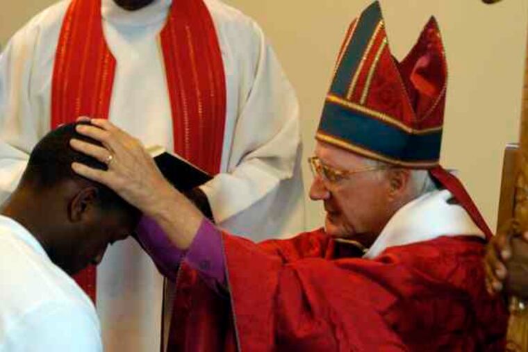 Episcopal Church Bishop Charles E. Bennison Jr. confirms a young congregant at Trinity Episcopal Church in Boothwyn.