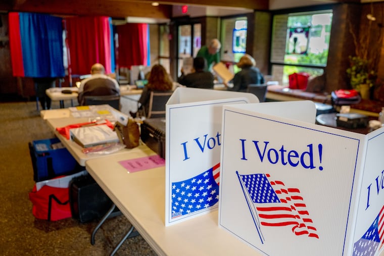 Vote signs on partitions for provisional ballots at the election polling place inside St. Michael’s Church, at King’s Highway and Chapel Avenue in Cherry Hill on June 10.