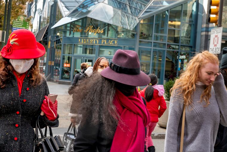 Shoppers on Chestnut Street last week, outside the Shops at Liberty Place.
