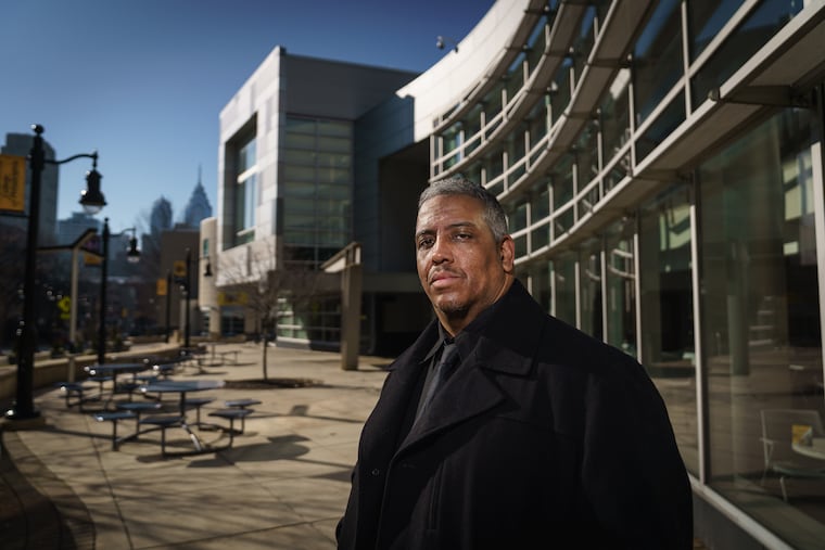 Luis "Suave" Gonzales on the Community College of Philadelphia campus last month. Gonzales, a juvenile lifer who was released from prison in 2017 after serving more than 30 years, now helps formerly incarcerated people attend CCP.
