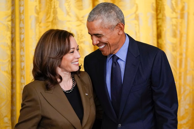 Former President Barack Obama talks with Vice President Kamala Harris during an event about the Affordable Care Act in April 2022.