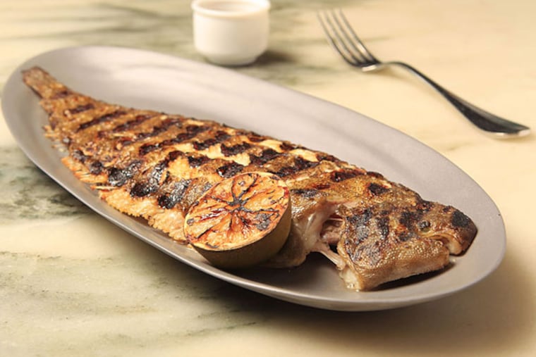 The grilled whole Dover sole at a.kitchen, served bone-in over brown butter-lime vinaigrette, may present a challenge for some diners, but it's worth it.