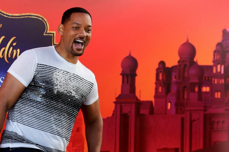 U.S. actor Will Smith reacts during a news conference with director Guy Ritchie and stars Mena Massoud and Naomi Scott, ahead of the regional launching of Disney's live-action "Aladdin," in the Jordanian capital Amman, Monday, May 13, 2019. The film opens in Middle East theaters May 23, 2019. (AP Photo/Raad Adayleh)