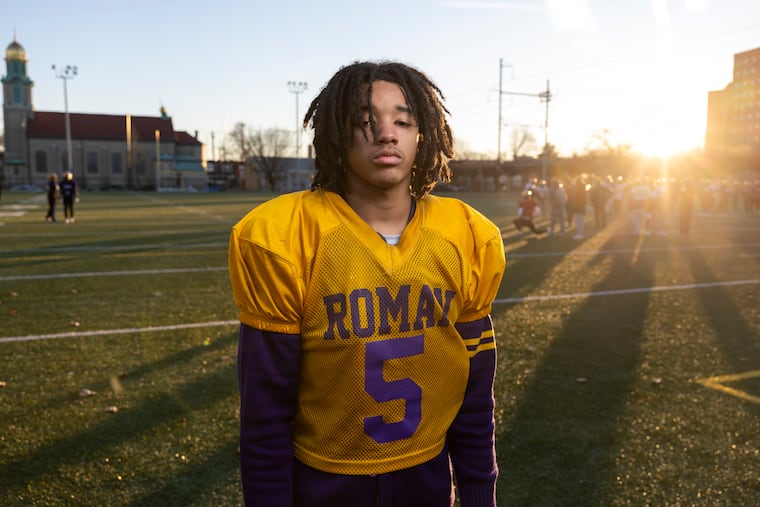 Roman Catholic receiver Ash Roberts poses for a portrait on Wednesday.