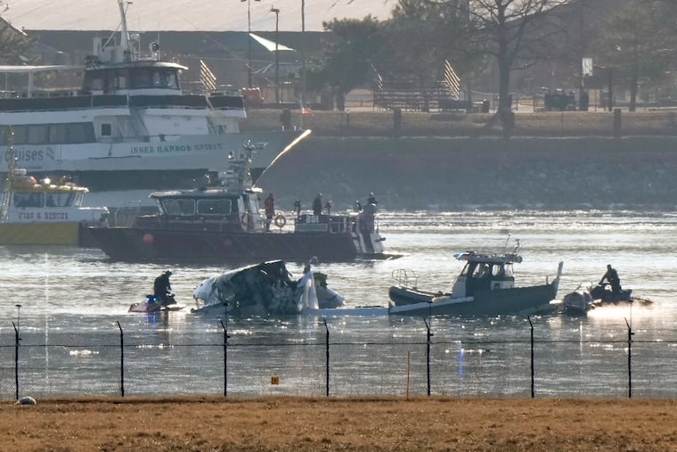 Search and rescue efforts are seen around a wreckage site in the Potomac River from Ronald Reagan Washington National Airport, early Thursday morning, Jan. 30, 2025, in Arlington, Va.