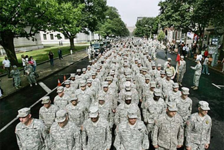 Hundreds of New Jersey National Guard soldiers fill the street to march through downtown Trenton. (Mel Evans / Associated Press)