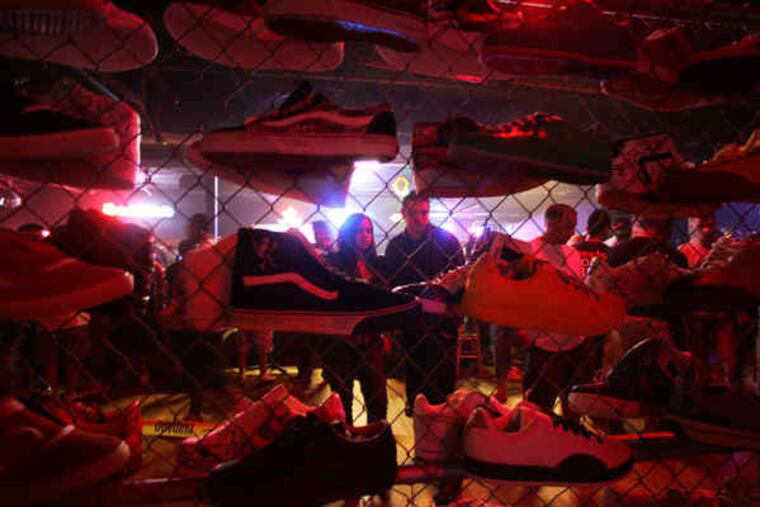 One of many displays of the coveted footwear at "Sneaker Pimps," a traveling show at the Starlight Ballroom.