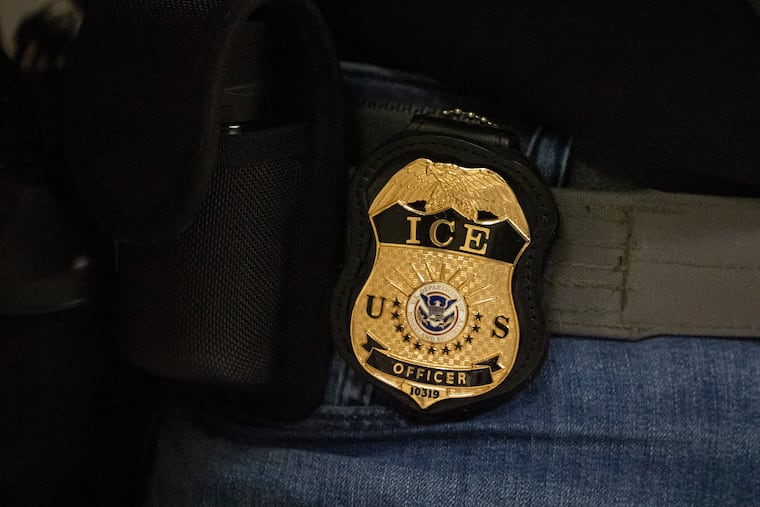 File photo of a federal agent wearing an Immigration and Customs Enforcement badge, June 10, 2025.