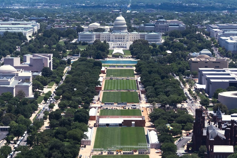The U.S. Capitol backdrops the National Mall where construction crews prepare The Mall for the 250 anniversary celebrations, Thursday, May 28, 2026, in Washington. (AP Photo/Manuel Balce Ceneta)