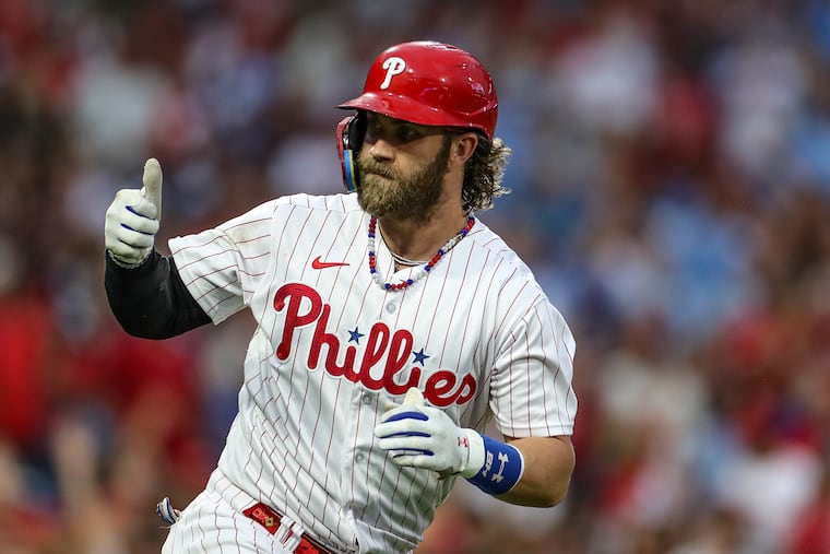 Bryce Harper gestures after hitting a home run in the second inning.