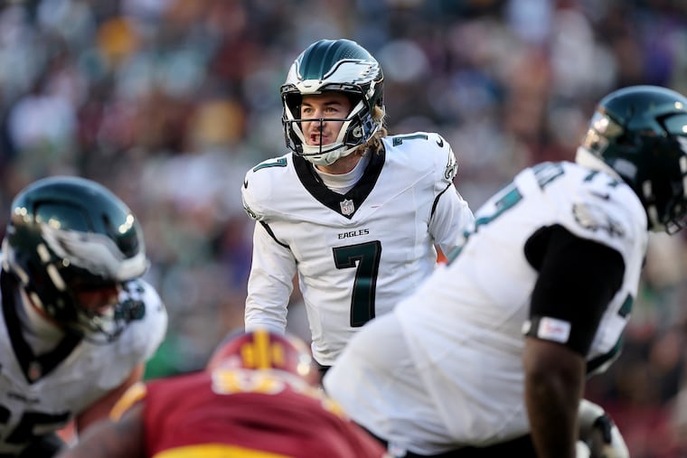 Eagles quarterback Kenny Pickett directing the offense during the loss to the Washington Commanders.