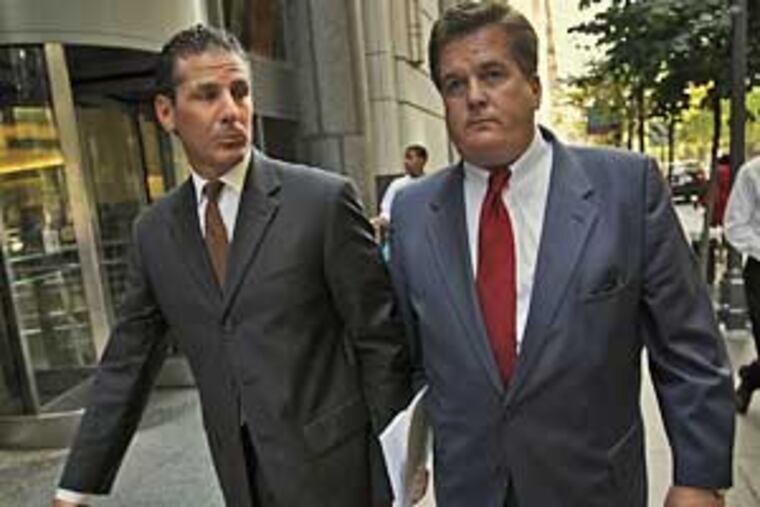 Gerald Garzone, left, and his attorney, William J. Brennan, leave the Criminal Justice Center on Tuesday after Garzone and his brother, Louis, pled guilty to illegally selling body parts. (Alejandro A. Alvarez / Daily News)