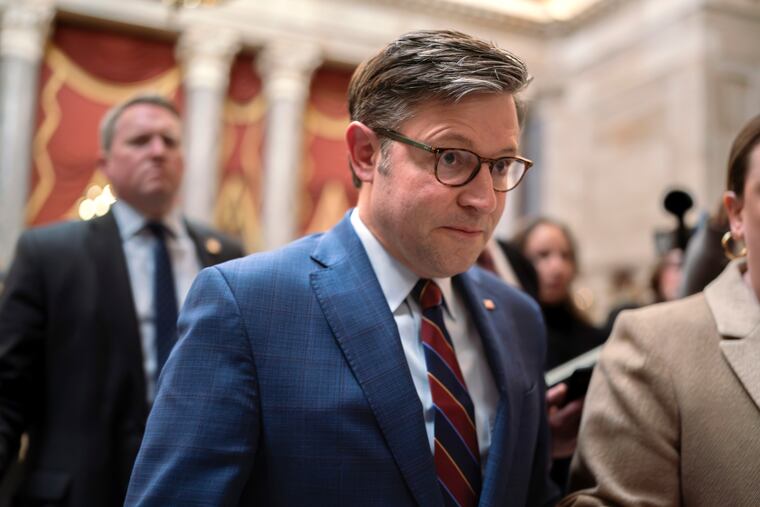 Speaker of the House Mike Johnson, R-La., maneuvers past reporters asking about the Senate border security bill as he arrives at his office in the Capitol in February. Johnson had declared the bipartisan bill "dead on arrival" in the House.