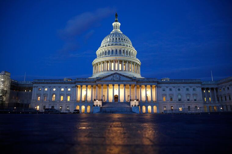 In this Dec. 4, 2019, file photo, fight shines on the U.S. Capitol dome in Washington.