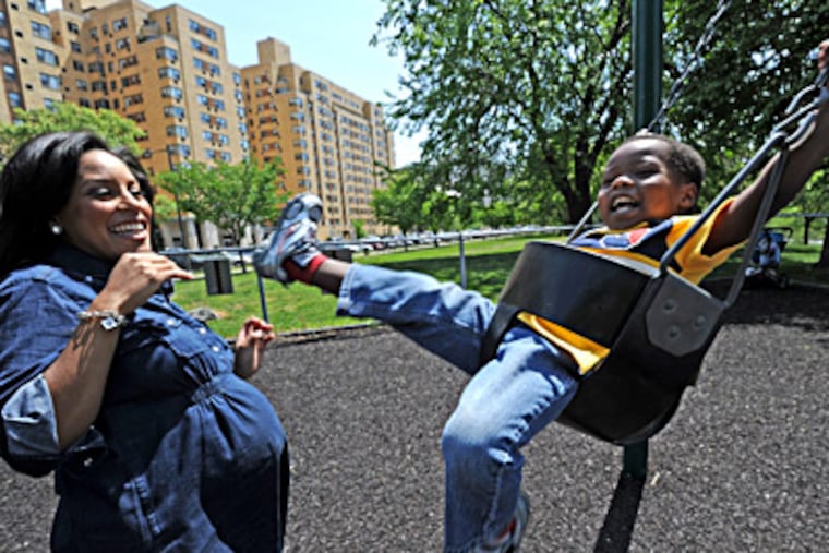 Sheinelle Jones, with her son Kayin Ojeh, is pregnant with twins — a boy and a girl. They are due Aug. 12, but are expected sooner. APRIL SAUL / Staff Photographer