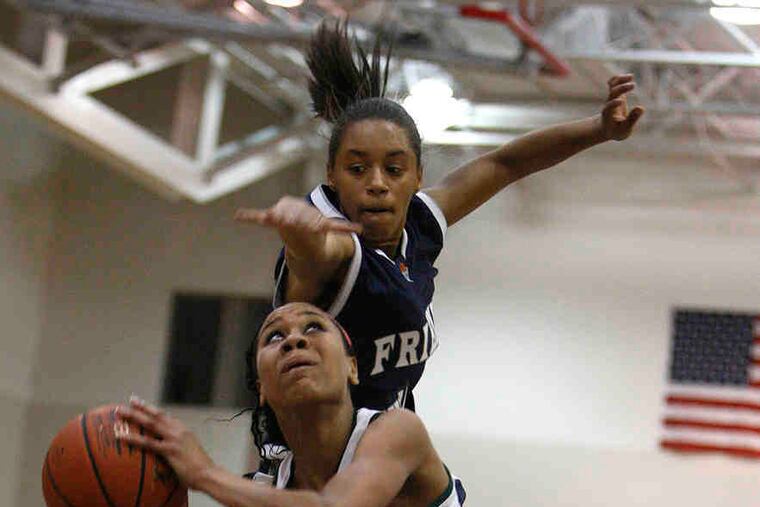 Shipley's Aja Ellison is fouled from behind by Friends' Central's Maria Conyers-Jordan. The Gators' victory cemented their second league championship in three seasons.