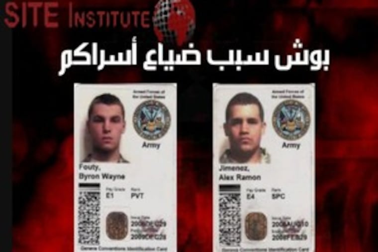 This image, from a video obtained by the Washington-based SITE Institute, shows ID cards of Pvt. Byron W. Fouty, of Waterford, Mich., and Spc. Alex R. Jimenez, 25, of Lawrence, Mass.