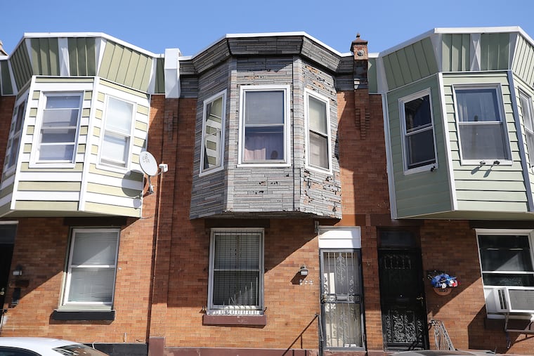 City prosecutors have charged five people with theft and other counts for allegedly using forged deeds to steal 11 properties in North and West Philadelphia. The home in the center, 2825 N. Stillman St., is one of the properties that is alleged to have been stolen.