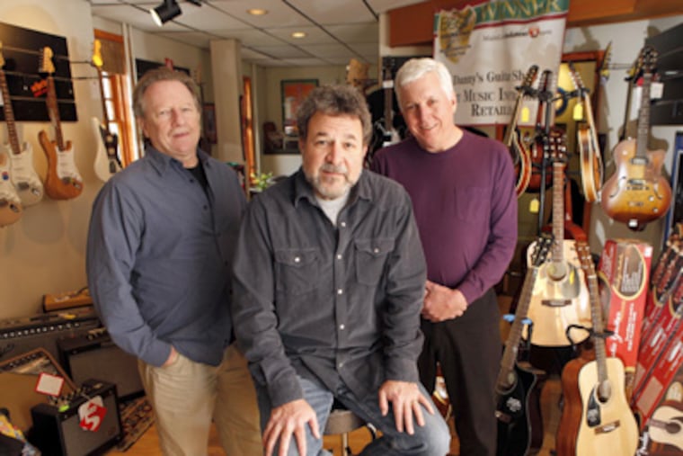 Danny Gold (center) runs Danny's Guitar Shop in Narberth with partners Larry Freedman (left) and Ron Stanford. (Laurence Kesterson / Staff Photographer)