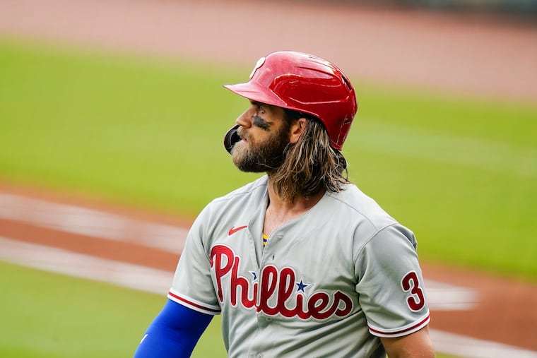 Philadelphia Phillies right fielder Bryce Harper (3) walks off the field after striking out during the first inning against the Atlanta Braves on Sunday, Aug. 23, 2020, in Atlanta.
