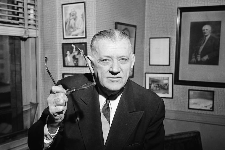 FILE - In this Feb. 13, 1957, file photo, NFL Commissioner Bert Bell gestures in his office in Philadelphia. His creation, the NFL draft, has become an industry unto itself and the league's third-most popular annual event behind the Super Bowl and opening weekend. (AP Photo/Warren M. Winterbottom, File)