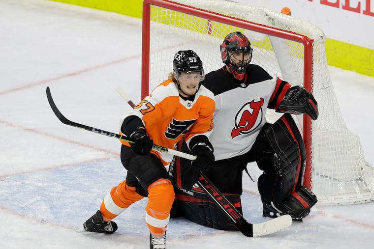 Flyers right winger Wade Allison skates past New Jersey Devils goaltender Scott Wedgewood in a game on May 10, 2021.